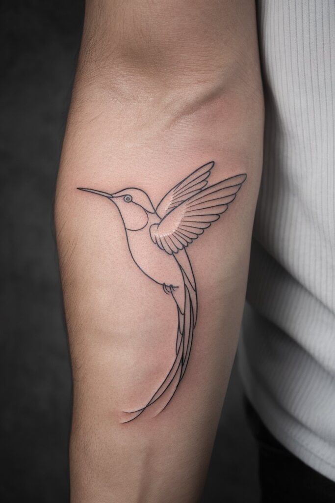 Minimalist Hummingbird Tattoo on Inner Arm