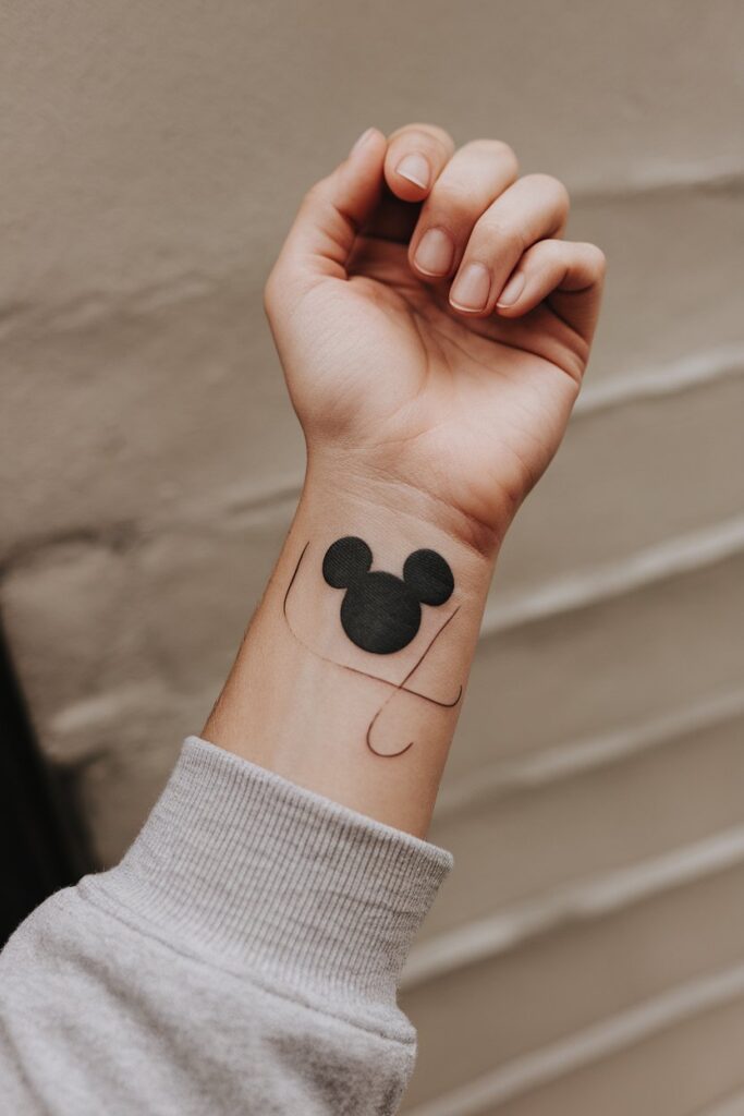 Minimalist Mickey Mouse Wrist Tattoo