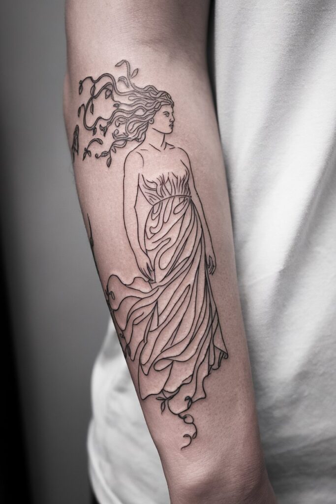 4. Flowing Aphrodite Forearm Tattoo