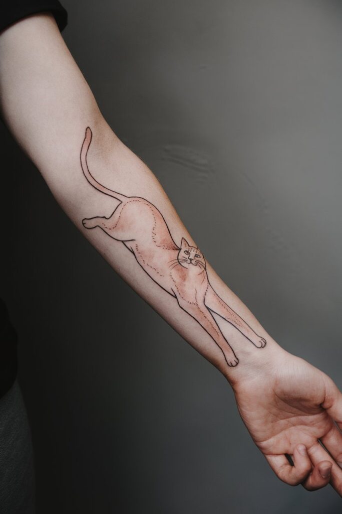 Playful Stretching Cat Outline Tattoo